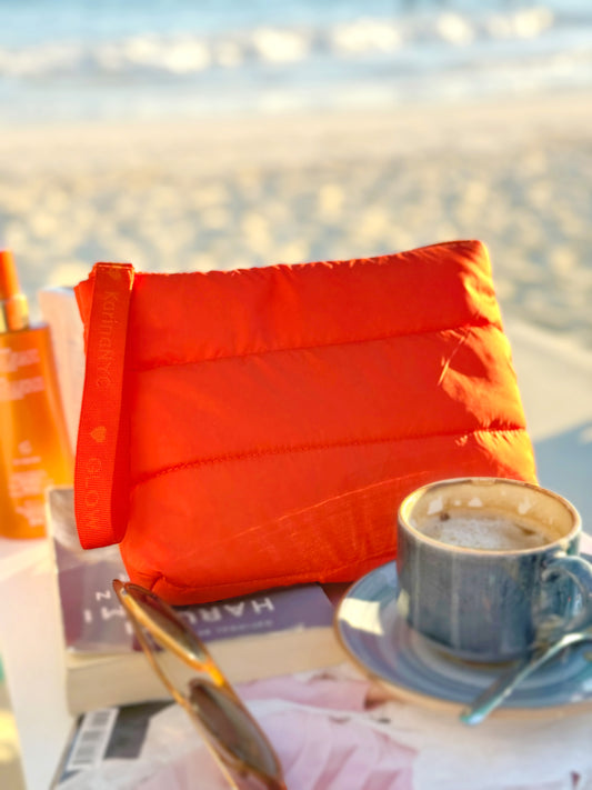 Product Card Image with detail: Quilted Orange Puffer Skincare Clutch