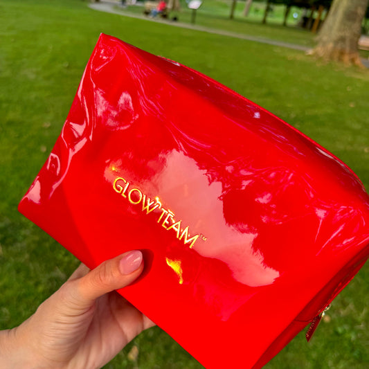 Product Card Image with detail: FREE GIFT | Glow Team Ruby Red Toiletry Bag